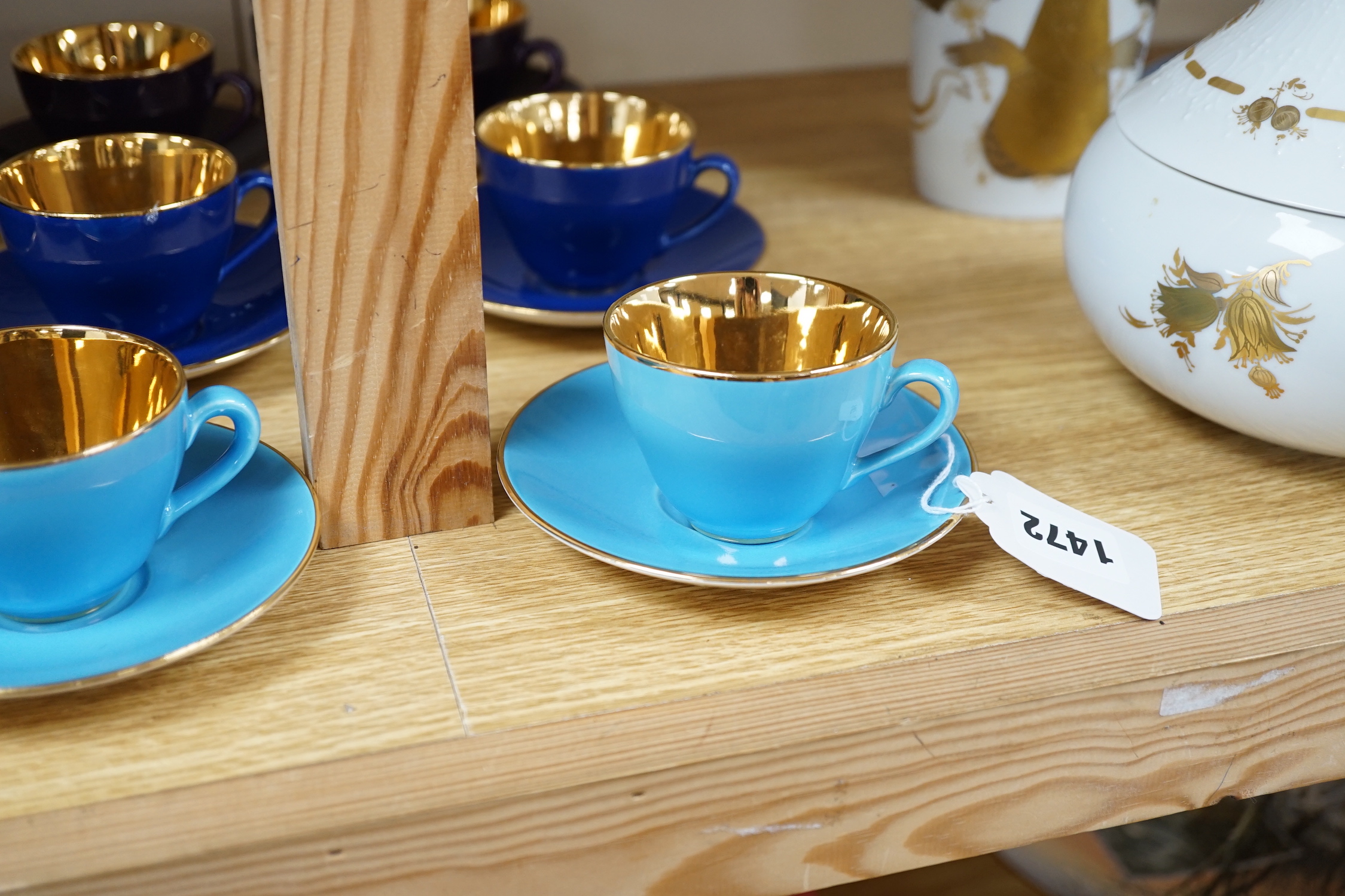 Fourteen Copenhagen Alumina, ‘Confetti’ patterned coffee cups and saucers in varying colours with gilt interiors
